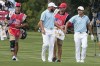 Cameron Young, left, and Collin Morikawa celebrate on the 12th fairway during their foursomes match at the Presidents Cup golf tournament at the Quail Hollow Club, Thursday, Sept. 22, 2022, in Charlotte, N.C. (AP Photo/Chris Carlson)