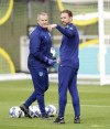 England manager Gareth Southgate, right, leads a training session ahead of the upcoming Nations League soccer match against Italy, at St. George's Park, Burton-on-Trent, England, Tuesday Sept. 20, 2022. (Mike Egerton/PA via AP)