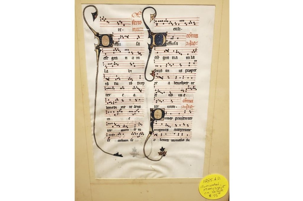 This photo provided by Will Sideri shows a 700-year-old manuscript that was used in the Beauvais Cathedral in France. Sideri bought the medieval manuscript for $75 at an estate sale on Sept. 3, 2022, in Waterville, Maine. An expert on manuscripts said the document, first reported by the Maine Monitor, could be worth as much as $10,000. (Will Sideri via AP)