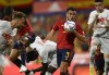 Spain's Eric Garcia, second right, and Switzerland's Breel Embolo in action during the UEFA Nations League soccer match between Spain and Switzerland, at the Benito Villamarin Stadium, in Seville, Spain, Saturday, Sept. 24, 2022. (AP Photo/Jose Breton)