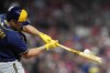 Milwaukee Brewers' Hunter Renfroe hits a two-run home run during the fifth inning of a baseball game against the Cincinnati Reds, Saturday, Sept. 24, 2022, in Cincinnati. (AP Photo/Jeff Dean)