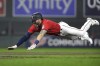Minnesota Twins' Jake Cave dives into third base on a triple against the Los Angeles Angels during the fourth inning of a baseball game Saturday, Sept. 24, 2022, in Minneapolis. (AP Photo/Andy Clayton-King)