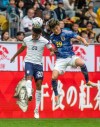 Japan's Machino Shuto, right, and Reggie Cannon from the USA try to get the ball during the international friendly soccer match between USA and Japan as part of the Kirin Challenge Cup in Duesseldorf, Germany, Friday, Sept. 23, 2022. (Bernd Thissen/dpa via AP)