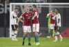 Hungary's Andras Schafer, left, and Hungary's Martin Ádám celebrate their victory in the UEFA Nations League soccer match between Germany and Hungary at the Red Bull Arena in Leipzig, Germany, Friday, Sept. 23, 2022. (AP Photo/Michael Sohn)