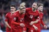 Denmark's Kasper Dolberg, second left, celebrates scoring with teammates Christian Eriksen, center right, Joachim Maehle and Andreas Skov Olsen, right, during the UEFA Nations League soccer match between Denmark and France at Parken Stadium in Copenhagen, Denmark, Sunday Sept. 25, 2022. (Liselotte Sabroe/Ritzau Scanpix via AP)