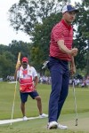 Jordan Spieth reacts to his chip to the fifth green during their singles match at the Presidents Cup golf tournament at the Quail Hollow Club, Sunday, Sept. 25, 2022, in Charlotte, N.C. (AP Photo/Julio Cortez)