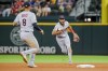 Cleveland Guardians shortstop Amed Rosario, right, tosses the ball to third baseman Gabriel Arias for an out during the fourth inning of a baseball game against the Texas Rangers in Arlington, Texas on Sunday, Sept. 25, 2022. (AP Photo/Gareth Patterson)