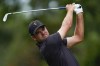 Corey Conners, of Canada, hits from the sixth tee during their singles match at the Presidents Cup golf tournament at the Quail Hollow Club, in Charlotte, N.C., Sunday, Sept. 25, 2022.&nbsp;Conners, of Listowel, Ont., lost to Xander Schauffele 1 up in the days seventh match to clinch the American victory. THE CANADIAN PRESS/AP-Julio Cortez