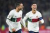 Portugal's Diogo Dalot, who scored his side's third goal, celebrates with Portugal's Cristiano Ronaldo, right, during the UEFA Nations League soccer match between the Czech Republic and Portugal at the Sinobo stadium in Prague, Czech Republic, Saturday, Sept. 24, 2022. (AP Photo/Petr David Josek)