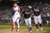 Atlanta Braves' Orlando Arcia, center, celebrates after his two-run home run with Marcell Ozuna, right, during the sixth inning of a baseball game against the Washington Nationals, Monday, Sept. 26, 2022, in Washington. Nationals catcher Riley Adams, left, ,looks on. (AP Photo/Nick Wass)