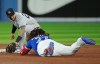 Toronto Blue Jays designated hitter Vladimir Guerrero Jr. (27) is tagged out at second base by New York Yankees second baseman Gleyber Torres (25) after hitting an RBI single during sixth inning American League MLB baseball action in Toronto on Tuesday, September 27, 2022. THE CANADIAN PRESS/Nathan Denette