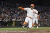 San Francisco Giants' Thairo Estrada slides home to score against the Colorado Rockies during the first inning of a baseball game in San Francisco, Tuesday, Sept. 27, 2022. (AP Photo/John Hefti)