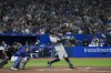 New York Yankees designated hitter Aaron Judge (99) hits his 61st home run of the season, a two-run shot, as Toronto Blue Jays catcher Danny Jansen (9) looks on during seventh inning American League MLB baseball action in Toronto on Wednesday, September 28, 2022. THE CANADIAN PRESS/Nathan Denette