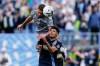 CF Montreal defender Zorhan Bassong, top, heads the ball over Philadelphia Union defender Nathan Harriel (26) during the second half of an MLS soccer match&nbsp;in Chester, Pa., Saturday, April 23, 2022. THE CANADIAN PRESS/AP-Matt Rourke