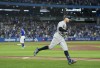 New York Yankees designated hitter Aaron Judge (99) rounds the bases after hitting his 61st home run of the season, a two-run shot, off Toronto Blue Jays relief pitcher Tim Mayza (58) during seventh inning American League MLB baseball action in Toronto on Wednesday, September 28, 2022. THE CANADIAN PRESS/Nathan Denette