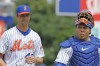 FILE - New York Mets' Jacob deGrom walks onto the field with catcher Francisco Álvarez to pitch for Triple-A Syracuse against Omaha in a baseball game in Syracuse, N.Y., July 27, 2022. The first-place Mets are calling up top prospect Álvarez for their pivotal weekend series against the Atlanta Braves, according to a person familiar with the decision. The person confirmed the move to The Associated Press on condition of anonymity Thursday night, Sept. 29, because the Mets had not yet announced the transaction. (Scott Schild/The Post-Standard via AP)