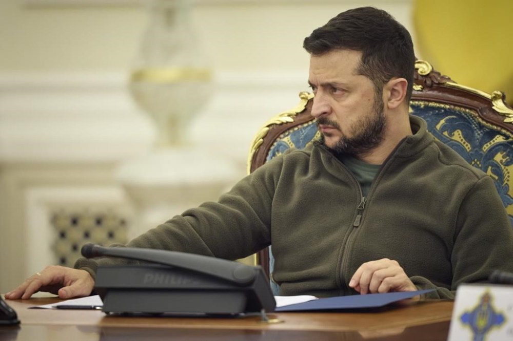 In this photo released by Ukrainian Presidential Press Office, Ukrainian President Volodymyr Zelenskyy leads a meeting of the National Security and Defense Council in Kyiv, Ukraine, Friday, Sept. 30, 2022. Ukraine's president says his country is submitting an