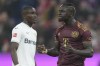 Bayern's Sadio Mane, right, celebrates after scoring during the German Bundesliga soccer match between FC Bayern Munich and Bayer 04 Leverkusen at the Allianz Arena in Munich, Germany, Sept. 30, 2022. (AP Photo/Matthias Schrader)
