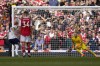 Tottenham's Harry Kane, left, scores his side's opening goal during the English Premier League soccer match between Arsenal and Tottenham Hotspur, at Emirates Stadium, in London, England, Saturday, Oct. 1, 2022. (AP Photo/Kirsty Wigglesworth)