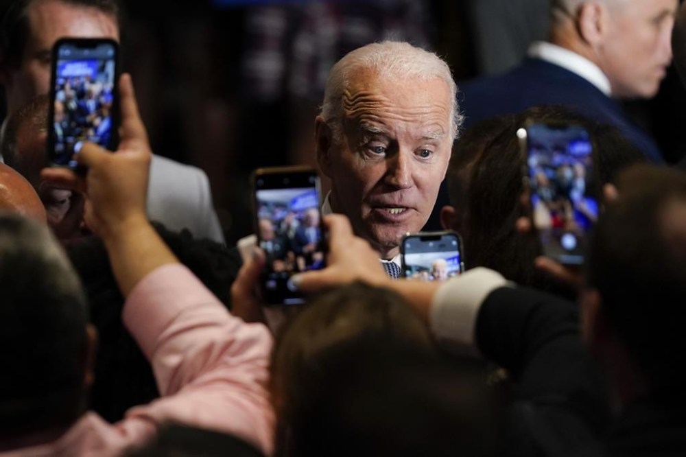 FILE - President Joe Biden greets people after speaking during a Democratic National Committee event at the National Education Association Headquarters, Sept. 23, 2022, in Washington. Biden is picking up the pace of his high-dollar fundraisers for party candidates and committees in the last stretch ahead of the midterms. The receptions have been one of the most visible ways Biden has been deployed this political season at a time when his approval ratings remain underwater and many Democrats aren’t eager to campaign with him. (AP Photo/Evan Vucci, File)