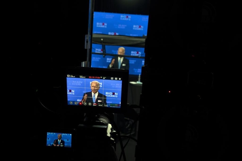 FILE - Democratic presidential candidate former Vice President Joe Biden is seen on monitors as he speaks during a virtual grassroots fundraiser at the Hotel DuPont in Wilmington, Del., Aug. 12, 2020. Biden is picking up the pace of his high-dollar fundraisers for party candidates and committees in the last stretch ahead of the midterms. The receptions have been one of the most visible ways Biden has been deployed this political season at a time when his approval ratings remain underwater and many Democrats aren’t eager to campaign with him. (AP Photo/Carolyn Kaster, File)