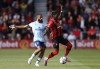 Brentford's Bryan Mbeumo, left, and Bournemouth's Jordan Zemura battle for the ball during their English Premier League soccer match at the Vitality Stadium, Bournemouth, England, Saturday, Oct. 1, 2022. (Steven Paston/PA via AP)
