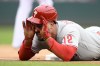 Philadelphia Phillies' Kyle Schwarber looks towards the dugout after he tripled during the first inning of the first baseball game of a doubleheader against the Washington Nationals, Saturday, Oct. 1, 2022, in Washington. (AP Photo/Nick Wass)