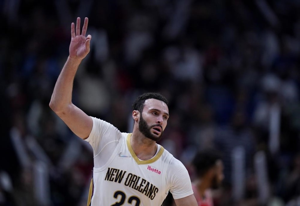 FILE - New Orleans Pelicans forward Larry Nance Jr. (22) celebrates after scoring a basket during the second half of the team's NBA basketball game against the Chicago Bulls in New Orleans, March 24, 2022. The agent for Nance says his client has agreed to a two-year extension worth $21.6 million. Mark Bartelstein says the agreement runs through the 2024-25 season. (AP Photo/Gerald Herbert, File)