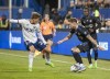D.C. United's Jackson Hopkins, left, puts pressure on CF Montreal's Joel Waterman during second half MLS soccer action in Montreal on Saturday, October 1, 2022. THE CANADIAN PRESS/Peter McCabe