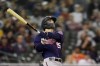 Minnesota Twins' Mark Contreras watches his solo home run during the fifth inning of a baseball game against the Detroit Tigers, Saturday, Oct. 1, 2022, in Detroit. (AP Photo/Carlos Osorio)