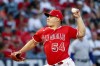 Los Angeles Angels starting pitcher Jose Suarez throws to a Texas Rangers batter during the first inning of a baseball game in Anaheim, Calif., Saturday, Oct. 1, 2022. (AP Photo/Ringo H.W. Chiu)