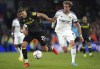 Aston Villa's Jan Bednarek, left, and Leeds United's Patrick Bamford battle for the ball during the English Premier League soccer match between Aston Villa and Leeds United, at Elland Road, Leeds, England, Sunday Oct. 2, 2022. (Tim Goode/PA via AP)