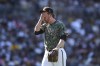 San Diego Padres relief pitcher Steven Wilson reacts as he walks to the dugout in the seventh inning of a baseball game against the Chicago White Sox, Sunday, Oct. 2, 2022, in San Diego. (AP Photo/Derrick Tuskan)