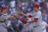St. Louis Cardinals relief pitcher Giovanny Gallegos, right, celebrates with catcher Andrew Knizner after the Cardinals defeated the San Diego Padres 5-4 in a baseball game Thursday, Sept. 22, 2022, in San Diego. (AP Photo/Gregory Bull)