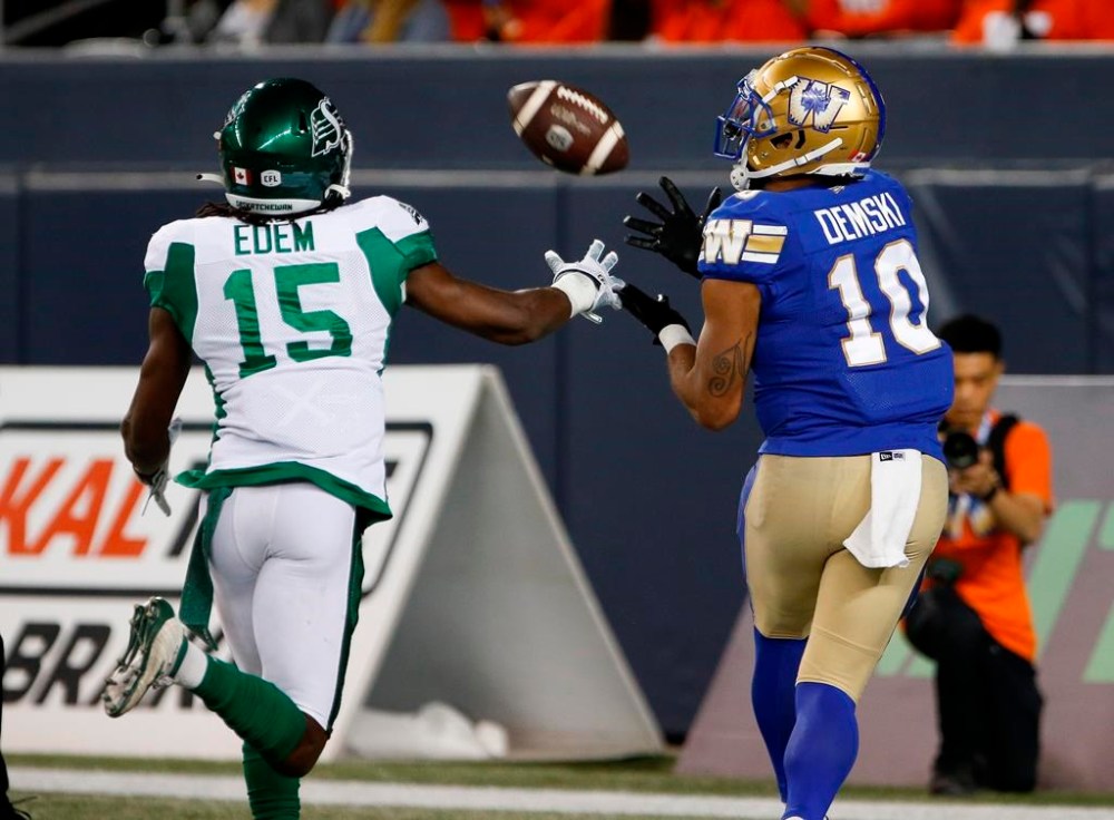 Winnipeg Blue Bombers' Nic Demski (10) catches the touchdown pass as Saskatchewan Roughriders' Mike Edem (15) defends during first half CFL action in Winnipeg Friday, September 30, 2022. Montreal Alouettes linebacker Tyrice Beverette and Nic Demski and quarterback Zach Collaros have been named Canadian Football League’s top performers for Week 17,THE CANADIAN PRESS/John Woods