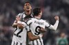 CORRECTS TOURNAMENT Juventus' Dusan Vlahovic, right, celebrates scoring with teammates during the Champions League soccer match between Juventus FC and Maccabi Haifa at Juventus Stadium, Turin, Italy, Wednesday Oct. 5, 2022. (Fabio Ferrari/LaPresse via AP)