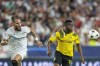 Dortmund's Youssoufa Moukoko, right, fights for the ball with Sevilla's Nemanja Gudelj during the group G Champions League soccer match between Sevilla and Borussia Dortmund at the Ramon Sanchez Pizjuan stadium in Seville, Spain, Wednesday, Oct. 5, 2022. (AP Photo/Jose Breton)