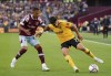 West Ham United's Thilo Kehrer, left, and Wolverhampton Wanderers' Pedro Neto battle for the ball during their English Premier League soccer match at the London Stadium, London, Saturday, Oct. 1, 2022, (Zac Goodwin/PA via AP)