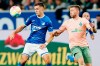 Hoffenheim's Christoph Baumgartner, left, and Bremen's Mitchel Weiser fight for the ball during the German Bundesliga soccer match between TSG 1899 Hoffenheim and Werder Bremen in Sinsheim, Germany, Friday, Oct. 7, 2022. (Uwe Anspach/dpa via AP)