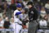 Texas Rangers interim manager Tony Beasley argues an out call with home plate umpire Adam Beck, during the seventh inning of the team's baseball game against the Seattle Mariners on Tuesday, Sept. 27, 2022, in Seattle. (AP Photo/John Froschauer)