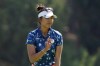 Alison Lee acknowledges the crowd after putting out on the eighth hole during the first round of the MEDIHEAL Championship golf tournament Thursday, Oct. 6, 2022, in Somis, Calif. (AP Photo/Mark J. Terrill)