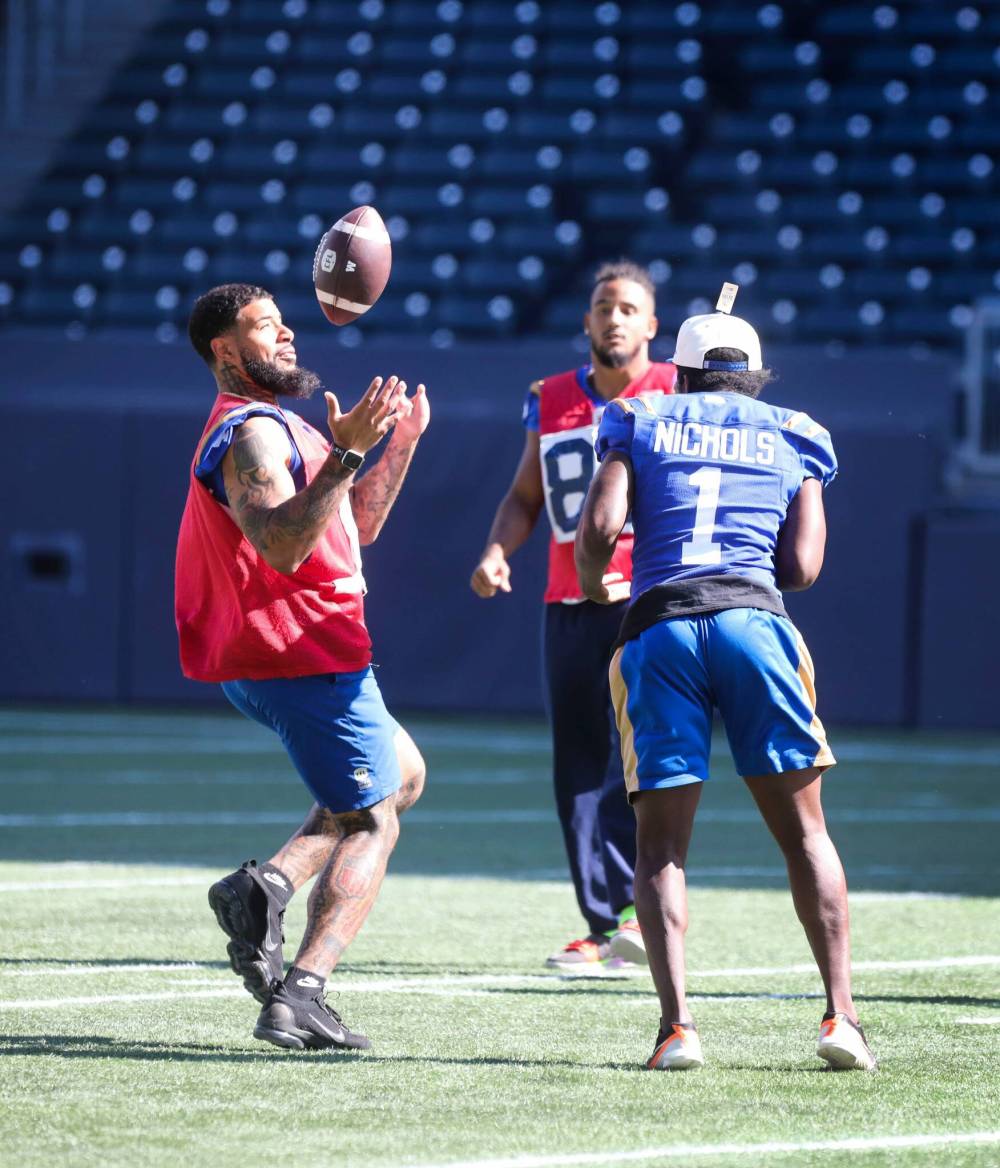 RUTH BONNEVILLE / WINNIPEG FREE PRESS
New Bomber J.T. Hassell (left) says hard work and his faith have allowed him to be successful.