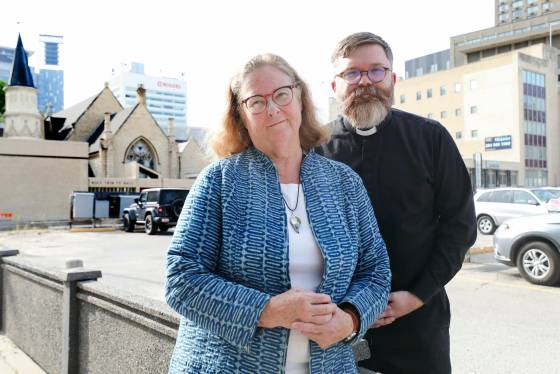Cathy Campbell (left) and her successor as rector at Holy Trinity, Andrew Rampton. (Ruth Bonneville / Winnipeg Free Press)