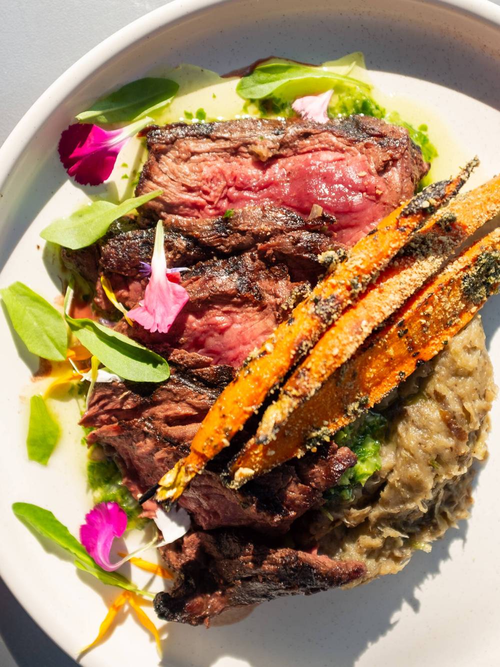 Meet Minneapolis
Sample the cedar maple baked beans, wild rice with currants, roasted sweet potatoes, a mushroom taco or elk corn sandwich before delving into one of the slow roasted bison dishes that are often a dinner special at Owamni.