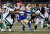 Jamal Parker runs after intercepting a Saskatchewan Roughriders pass during the first half. (John Woods / The Canadian Press)