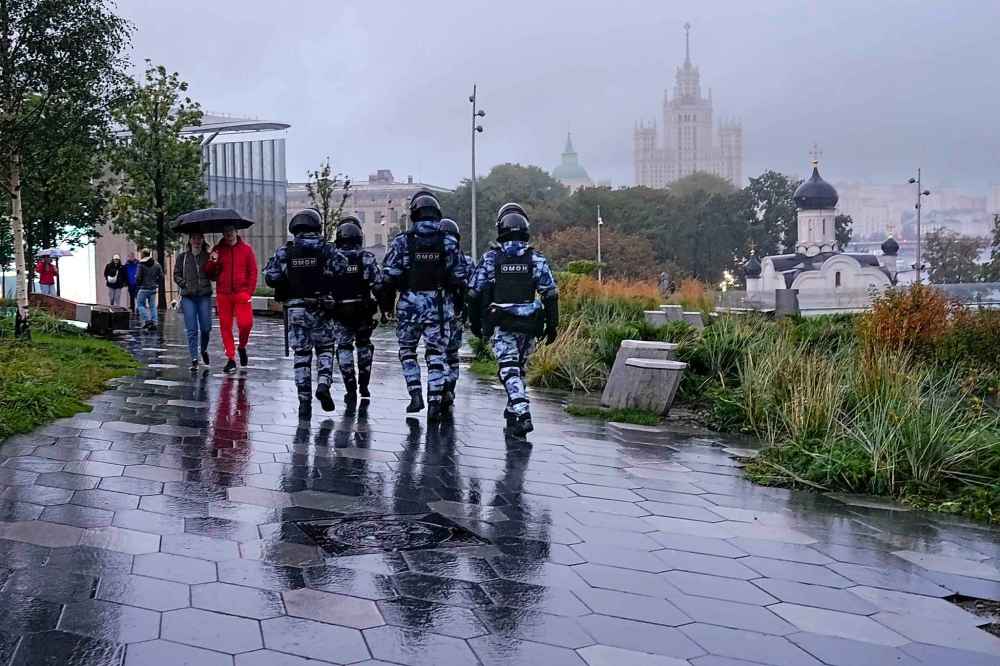 Police officers patrol the Zaryadye Park to prevent demonstrators during a protest against a partial mobilization in Moscow, Russia, Saturday, Sept. 24, 2022. (AP Photo)
