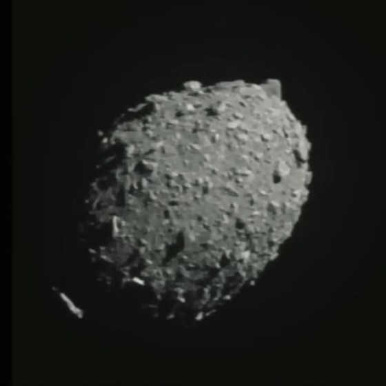 The asteroid Dimorphos is seen as the spacecraft flies toward it on Sept. 26. (ASI/NASA via Tjhe Associated Press)