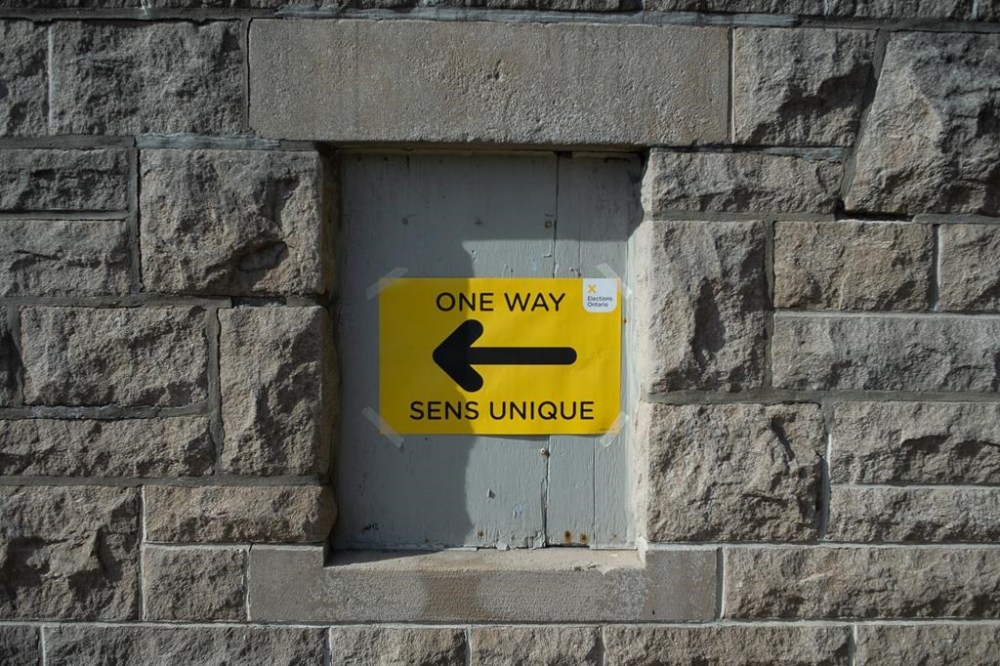 A sign directs voters to a polling station in Hamilton, Ont., Thursday, June 2, 2022. More Ontario municipalities are using online voting in this month's municipal elections than in 2018, despite the absence of provincial standards on how to conduct it. THE CANADIAN PRESS/Eduardo Lima.