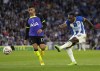 Tottenham's Cristian Romero, left, tries to block a shot from Brighton's Danny Welbeck during the English Premier League soccer match between Brighton and Tottenham Hotspur at the Falmer stadium in Brighton, England, Saturday, Oct. 8, 2022. (AP Photo/Alastair Grant)