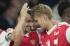 Arsenal's Fabio Vieira, left, celebrates after scored his side third goal during the Europa League group A soccer match between Bodo/Glimt and Arsenal, in London, Thursday, Oct. 6, 2022. (AP Photo/Kin Cheung)